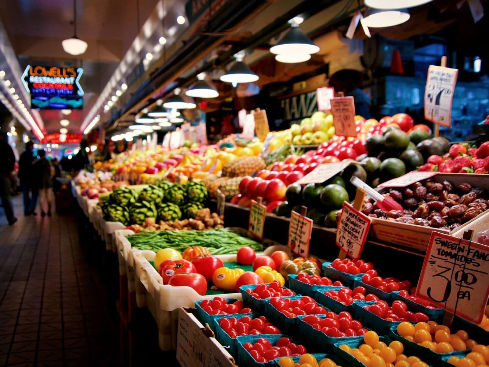 SEATTLE, WASHINGTON, USA - JAN 24th, 2017: Vegetables for sale in the high stalls at the Pike Place Market. This farmer market is a famous sight in downtown.